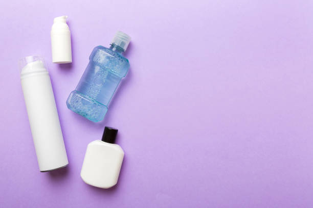 istock Composition with bath cosmetics on table. razor, toothpaste, soap, gel, toothbrush, mouthwash and other various accessories. Cosmetics for skin health. Bath Mockup for your logo 1442034370