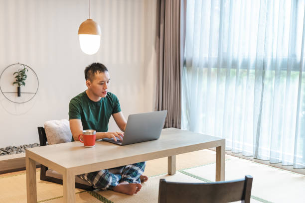 istock A Man Working and Using Laptop in a Hotel Room 1442036560