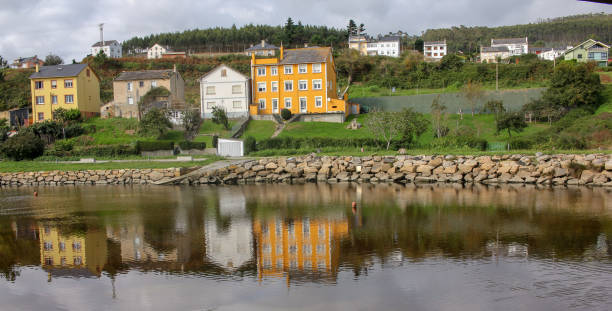 istock houses reflected in the river 1442037353
