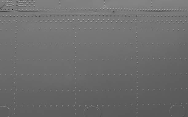 istock Aircraft metal plating texture with rivets 1442039878