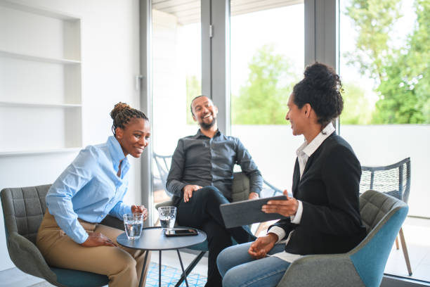 istock Mixed Race Group Of Office Workers In A Meeting Using A Digital Tablet 1442041144