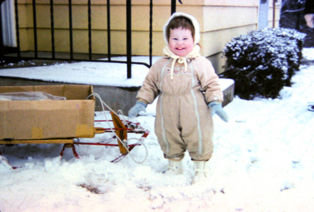 istock Two Year Old Playing in Snow - 1963 1442044482