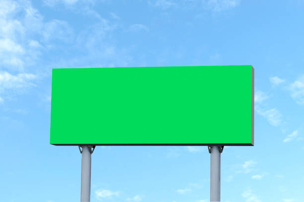 istock Outdoor billboard on blue sky background with green background mock up. clipping path; 1442062837