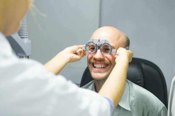 istock Man examining eyesight in optical clinic. 1442064585