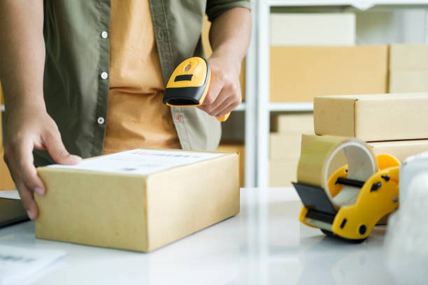 istock Young entrepreneur scanning online order box. 1442064735