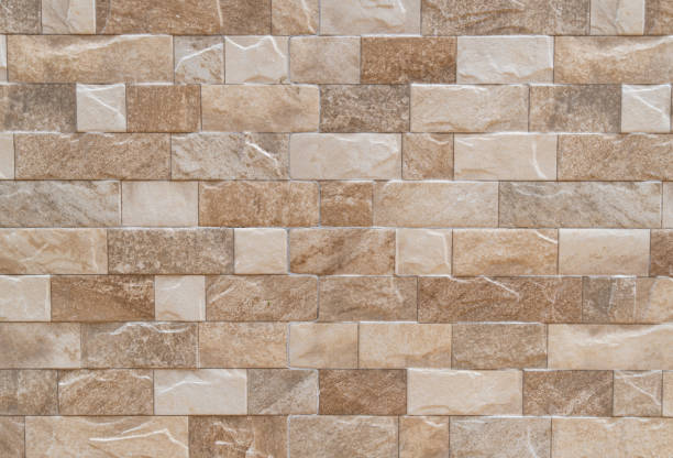 istock Tile background Small square tiles and brown rectangles are arranged alternately to decorate the wall. abstract background. 1442065452