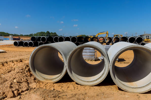 istock An industrial building at the construction site will be equipped with drainage systems made out of cement sewage concrete pipes. 1442069054