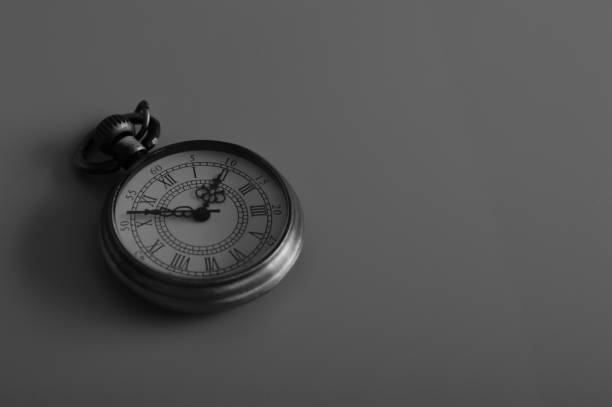 istock Black and white image of vintage pocket clock. Copy space for the text. 1442070094