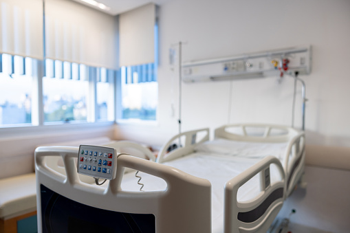 Empty gurney at a hospital room - healthcare and medicine concepts