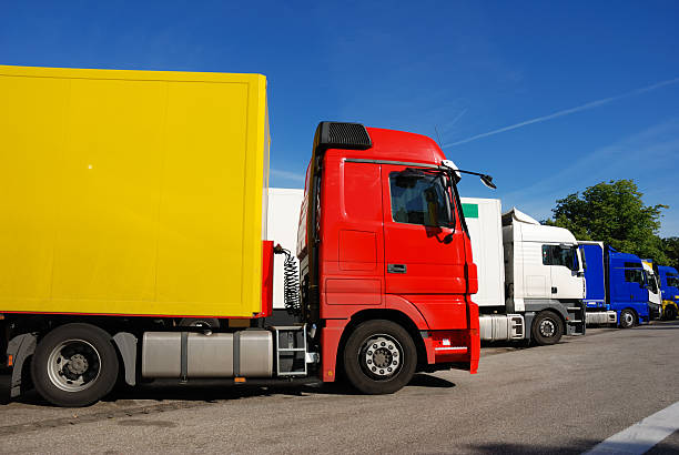 istock european trucks standing in a row at rest area, Germany 144207885