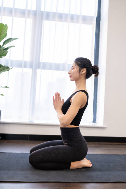 istock Young yoga teacher, meditating 1442079205