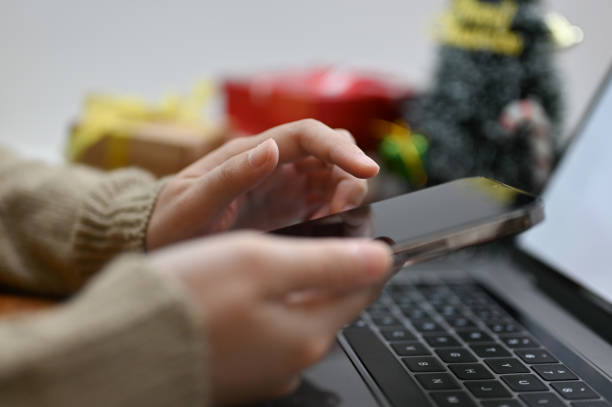 istock side view, a woman using her smartphone, chatting with someone at her office desk. 1442080478