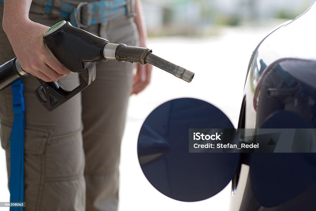 Expensive gasoline While refueling at the station Adult Stock Photo