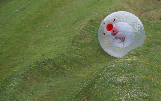 Zorb rolling down the hill