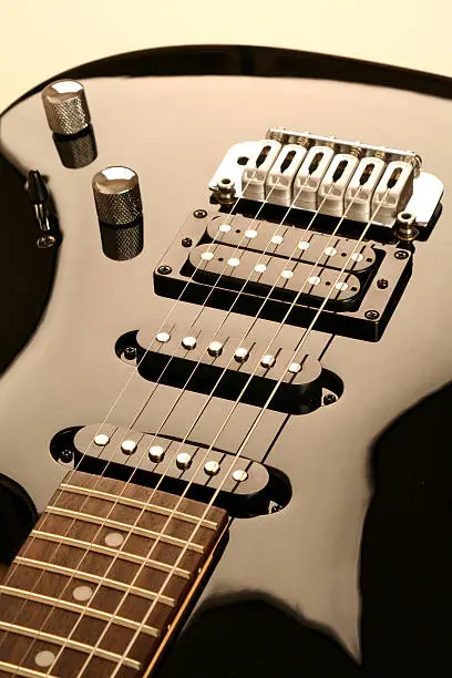 Closeup of a balck electronic guitar