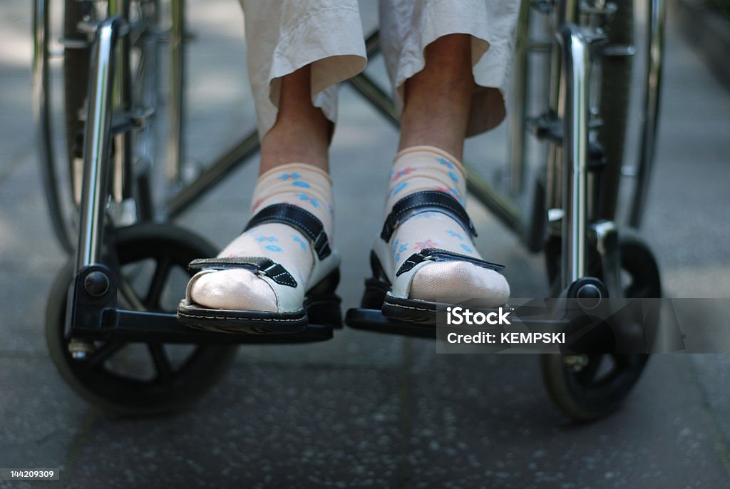 wheelchair sitting on wheelchair Senior Adult Stock Photo