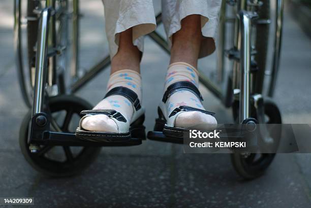 Wheelchair Stock Photo - Download Image Now - Senior Adult, Wheelchair, Picking Up