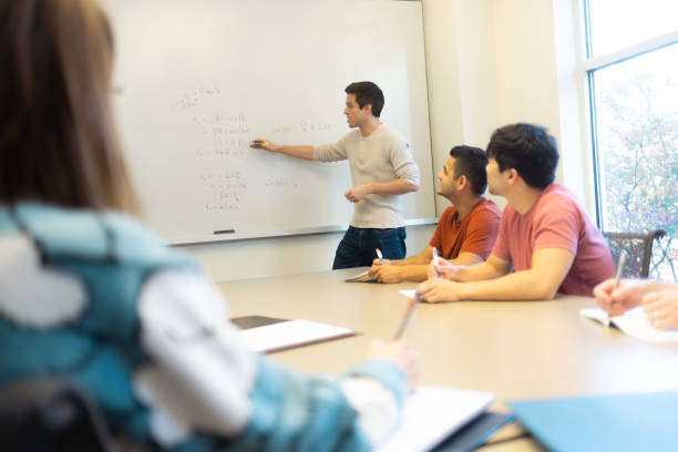 istock University Students in Conference Room Learning Medicine - Tutor - Small Group Teaching - Study Room - Wide Angle 1442093854