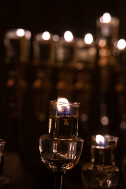 istock Hanukkah menorahs alight with glowing oil candles 1442094980