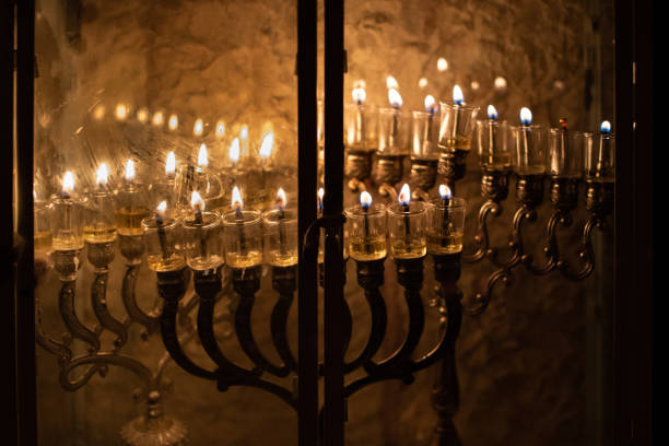 istock Hanukkah menorahs alight on a Jerusalem street 1442095167