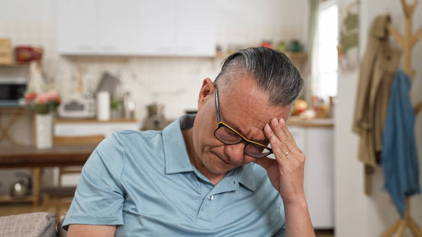 istock closeup of stressed asian elderly male worrying about problem alone at home. he props his head while thinking hard for solutions 1442099954