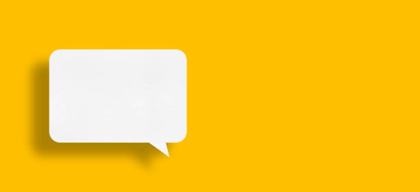 istock speech balloon shape white paper isolated on yellow background 1442100423