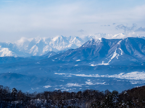 An aerial shot of the Japanese alps seen from the upper area of the Shiga Kogen ski area