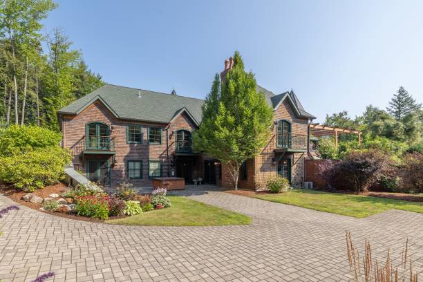 istock Beautiful view of a cozy mansion surrounded by evergreen trees 1442102737