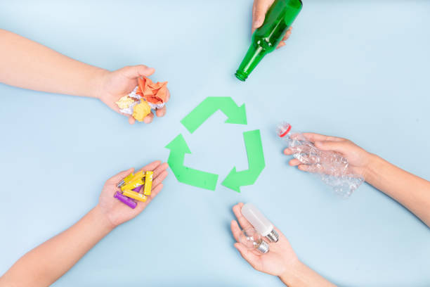 istock Five types of garbage in human hands with recycling sign - sorting, recycling waste concept 1442102911