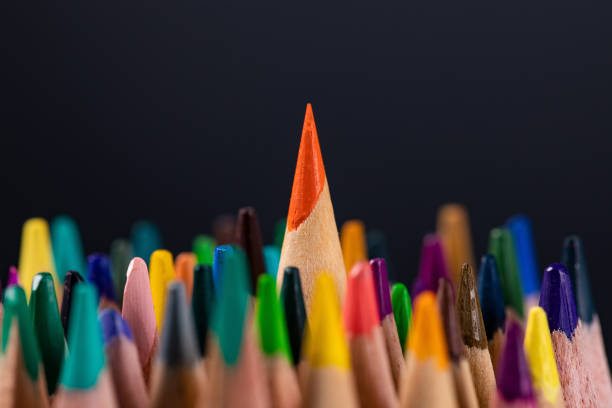 istock Selective focus shot of colorful pencils on black background 1442103175