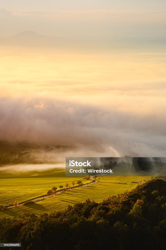 Central Bohemia High Beautiful foggy sunrise in Central Bohemia Highlands in Czech Republic Agricultural Field Stock Photo