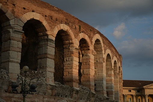 The Verona Arena Roman amphitheater in Italy with a cloudscape in the background