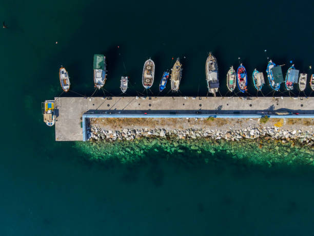 istock Aerial grayscale of ships on harbor 1442105802