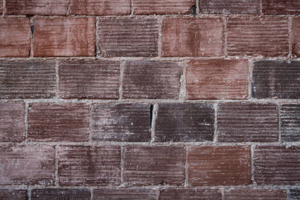 A closeup colorful dirty brick wall background