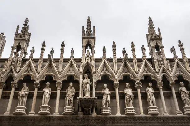 Photo of Beautiful view of the Santa Maria Della Spina church side wall with carvings and sculptures in Pisa