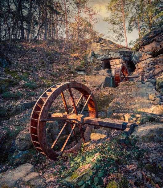 Majestic rural view of wooden watermill wheel in the countryside of Blankenburg, Germany A majestic rural view of wooden watermill wheel in the countryside of Blankenburg, Germany water wheel stock pictures, royalty-free photos & images