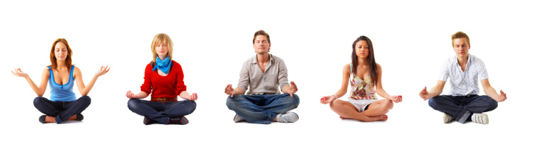 Group of young meditating people.