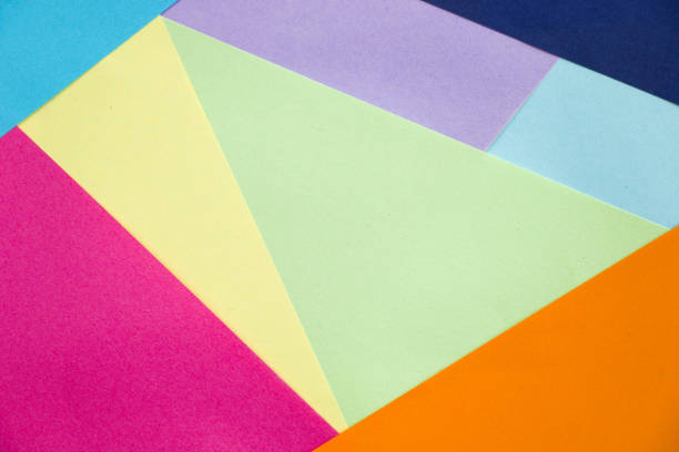 A closeup shot of geometric figures with pastel-colored as a background