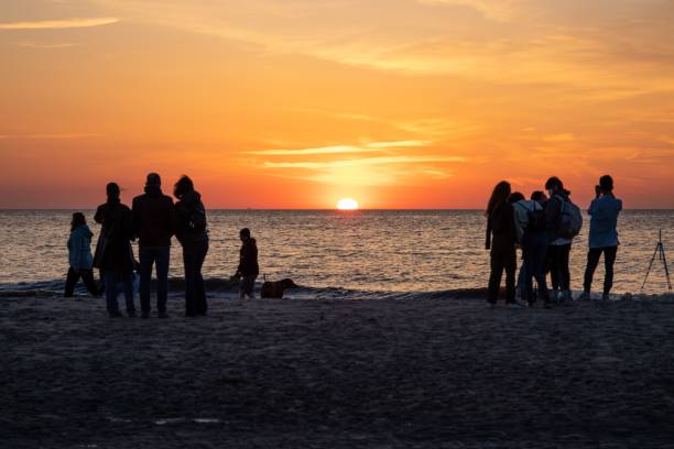 istock View of people watching a sunset in Noordwijk 1442110108