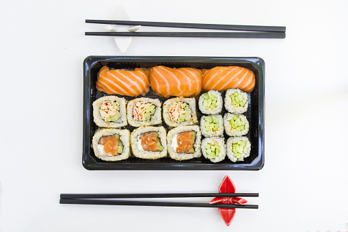 A top view shot of California sushi rolls on a white table cloth