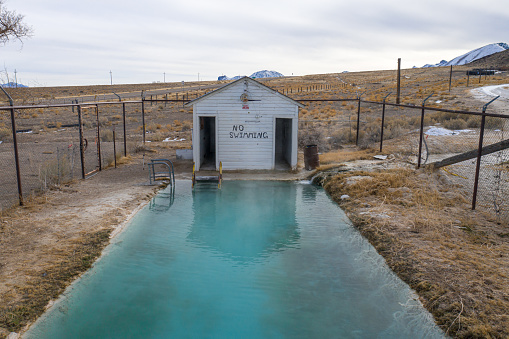 Warm Springs, Nevada, United States – January 31, 2021: The abandoned Warm Springs pool and bathhouse structure stand in a desolate area of central Nevada.