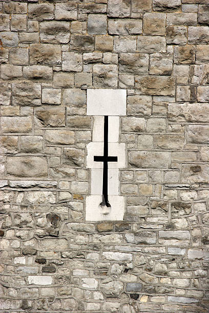 Brick wall with small window, Tower of London stock photo