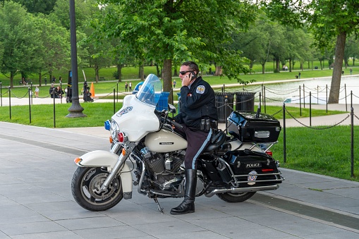 Washington DC, United States – May 14, 2019: Park Police man on Harley-Davidson motorbike in Washington, D.C.