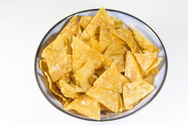 istock Bowl of Nachos chips on a white background 1442112703