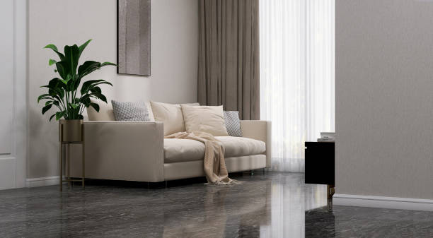 Cream colored fabric sofa, black cabinet and flat screen smart tv in modern and luxury white wallpaper wall and marble floor living room with sunlight from window sheer curtain