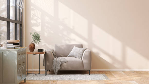 brown suede leather armchair, brass side table and pastel green wooden cabinet in modern and luxury beige wall and rug on parquet floor room with dappled sunlight from window - armchair sofa leather brown imagens e fotografias de stock