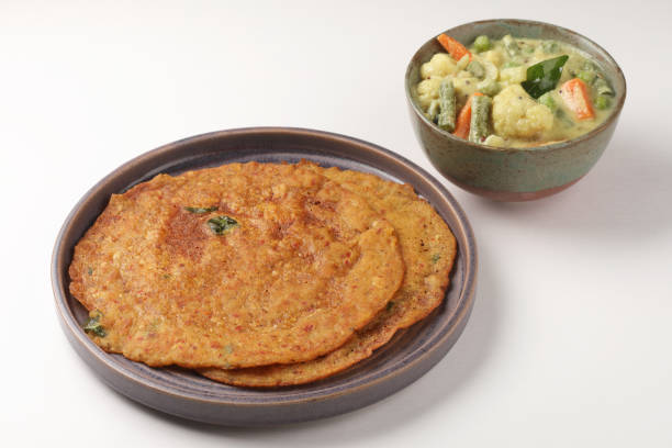 istock Indian dosa or Adai with mixed lentils with Mixed veg curry or kurma 1442114280