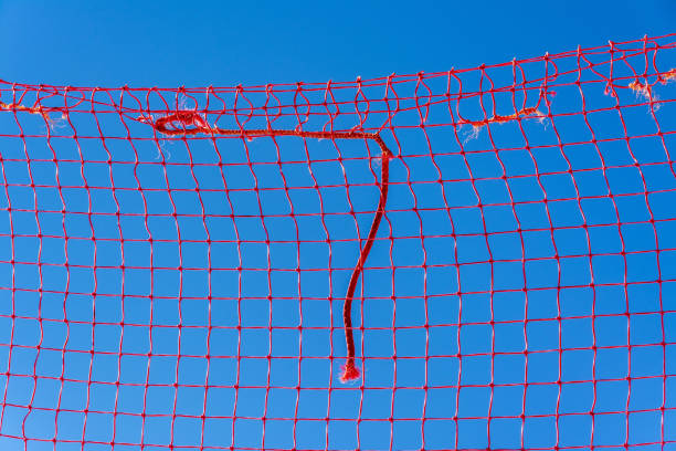 istock Red volleyball net on a blue background 1442115351