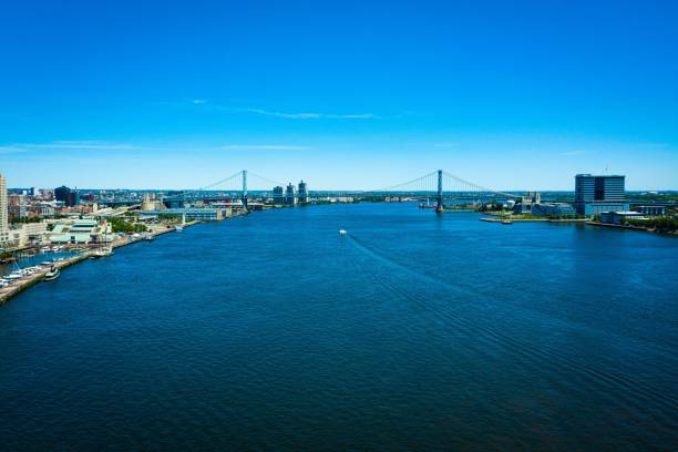 istock Drone shot over the blue water between architectures and harbor with a bridge and blue sky 1442115398