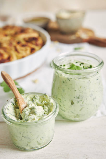 istock Vertical shot of herbs butter with pesto pizza rolls background on table 1442115848